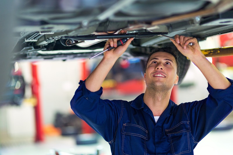 Man working on car at garage