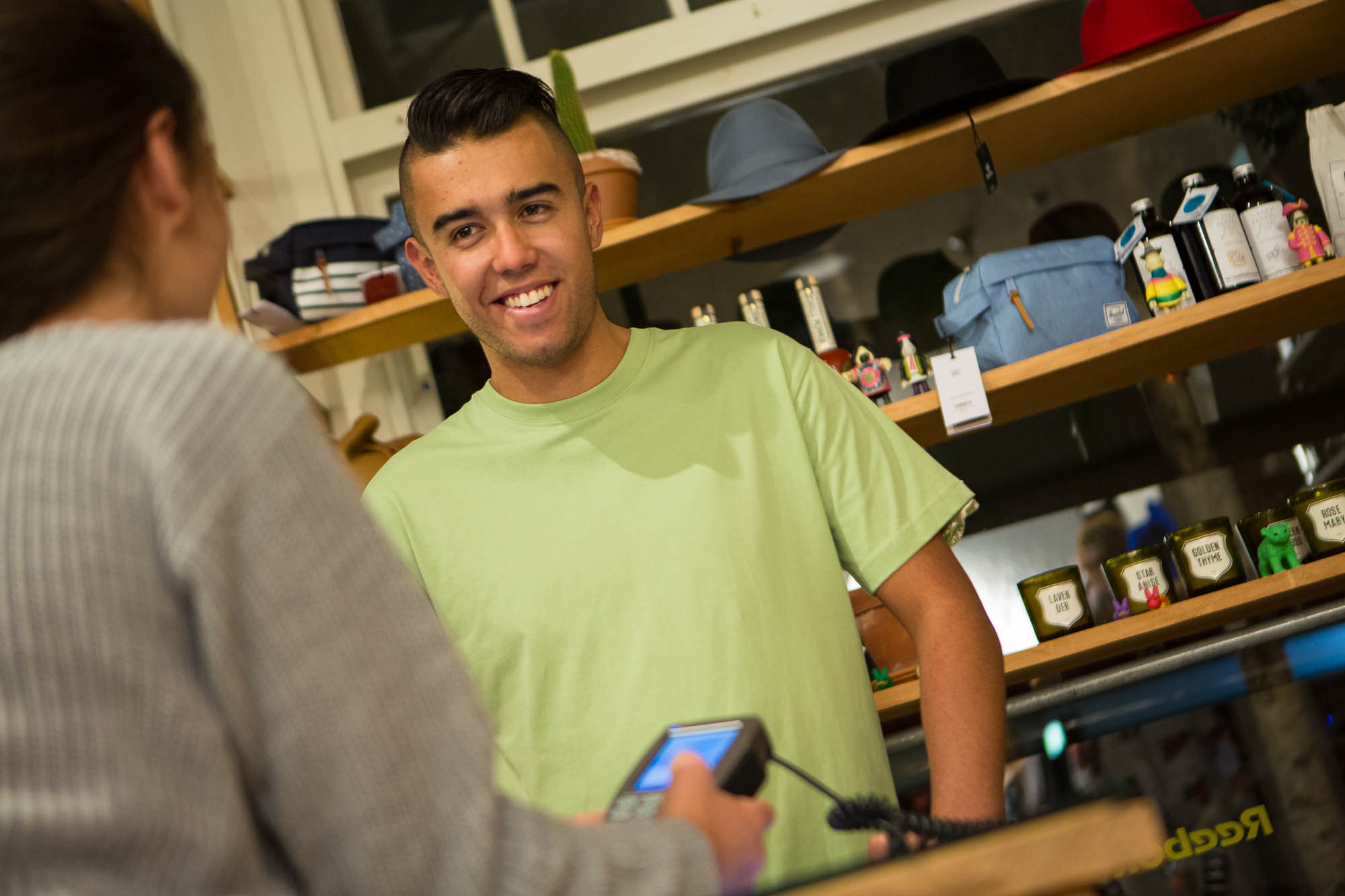 Man purchasing something at counter on EFTPOS
