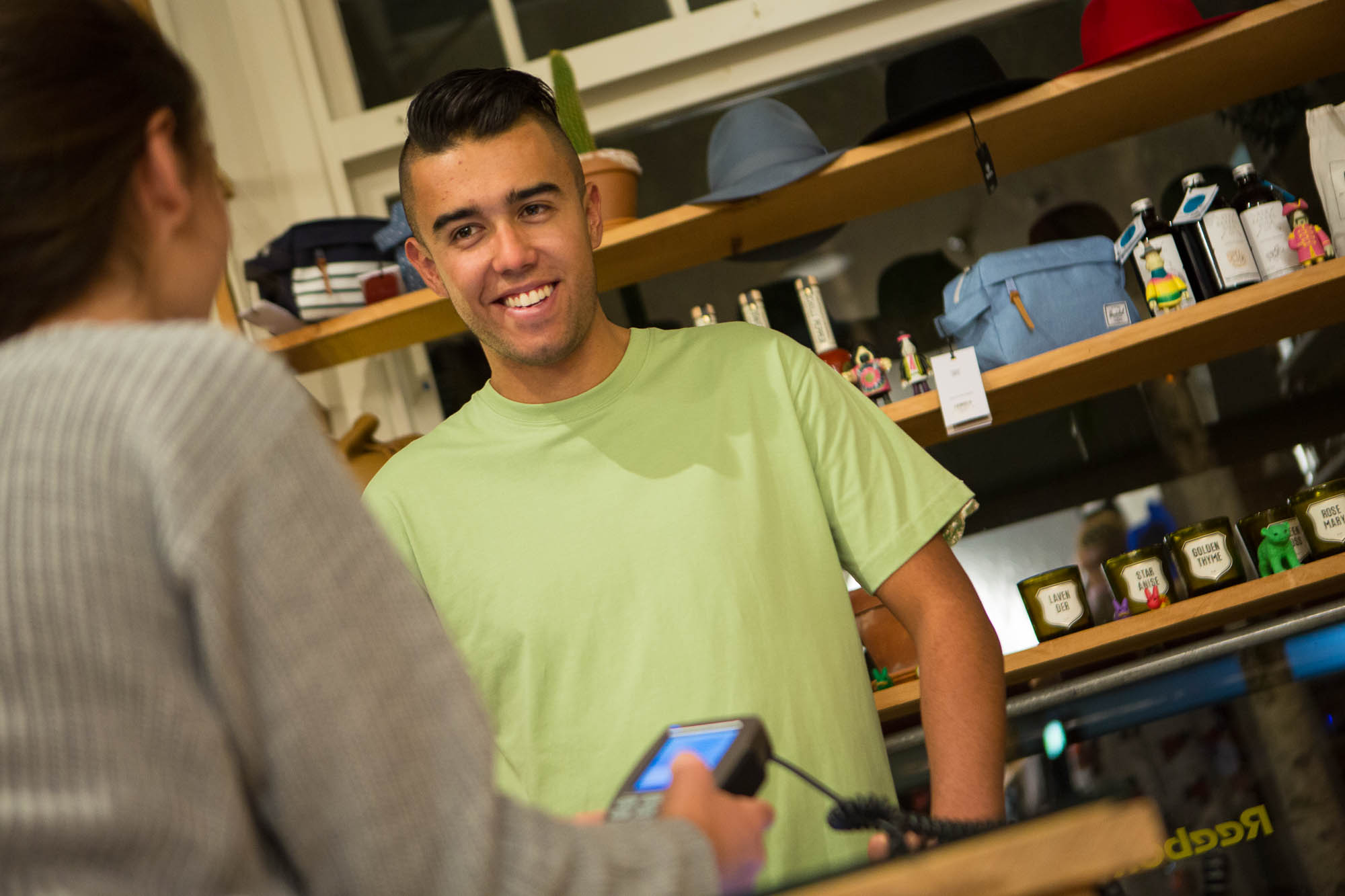 Man purchasing something at counter on EFTPOS