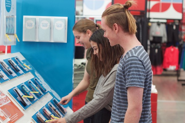 teens looking at mobile phones