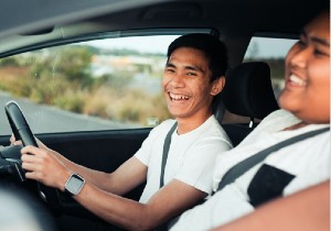 two males sitting in the car laughing